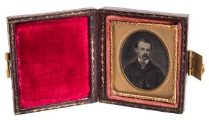 A 'postage stamp' size ambrotype portrait of a gentleman:,