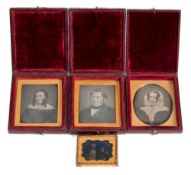 A family group of three daguerreotypes in red leather cases:,