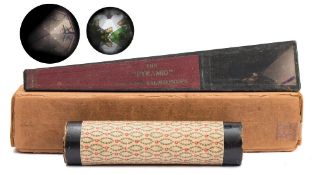 Kaleidoscope : wooden paper covered tube containing green glass pieces, 17cm high,
