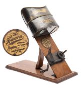 Kinora Viewer: with gilt lacquered viewer and manual hand crank drive on an oak plinth base,