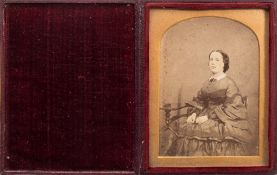 J C Barrable, London an ambrotype portrait of a seated woman:, hand tinted to face,