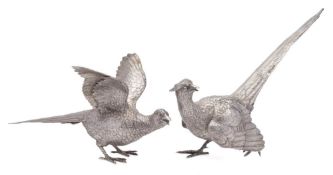 A pair of Continental silver models of a cock and hen pheasants,