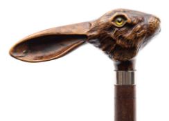 A 20th century walking stick: with moulded resin handle in the form of a hare's head with glass