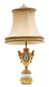 A late 19th century French 'Sevres' porcelain and ormolu table lamp: vase shaped body inset with