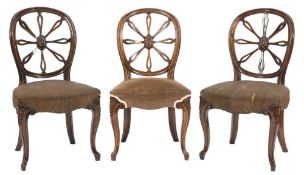 A set of nine 19th Century oak dining chairs in the Hepplewhite taste:,