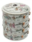 A set of four Chinese famille rose stacking bowls and cover: painted with dignitaries and