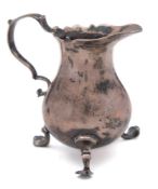 A George III silver cream jug, maker's mark worn, London, 1776: of baluster form with wavy edge rim,