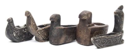 A group of five Islamic carved alabaster oil lamps: in the form of stylised birds: of traditional