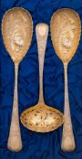 A pair of George III and later decorated silver gilt berry spoons, maker William Eley,