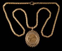 A half sovereign dated '1982', mounted within a 9ct gold locket and on a 9ct gold,