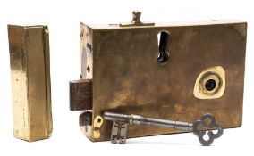 A Georgian brass door lock, of large size: of rectangular outline with cast steel key,
