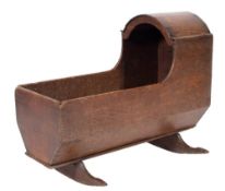 An 18th Century oak cradle:, of rectangular canted shape,