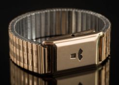 A gentleman's 9ct gold cased duo-dial rectangular wristwatch: with concealed hour and second dials,