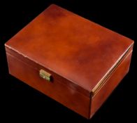 A tan leather covered jewellery box: with various compartments, approximately 30cm long x 23cm,