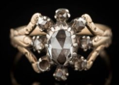 A Georgian gold and rose diamond oval cluster ring: with central oval 'Dutch' rose-cut diamond