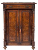 A late 19th Century Continental walnut side cabinet:, in the Aesthetic taste,