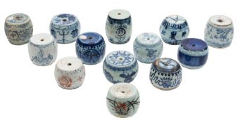 A collection of thirteen Chinese porcelain scroll weights: of barrel form,