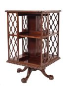 An Edwardian mahogany square revolving bookcase:,
