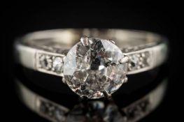 A diamond solitaire ring: the round old brilliant-cut diamond approximately 7.7mm diameter x 3.