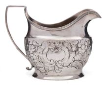 A George III silver cream jug, maker's mark worn, London, 1803: of barge shaped outline,