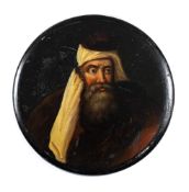 A 19th century papier mache snuff box: the circular lid decorated with a portrait of a bearded