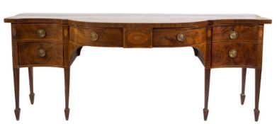 A George III mahogany and inlaid sideboard:, of bowed and concave fronted outline,