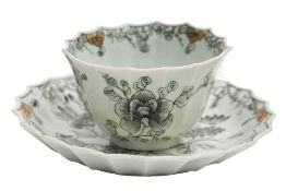 A First Period Worcester teabowl and saucer: of fluted form with flaring rims,