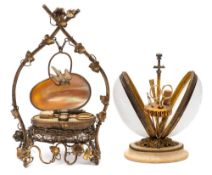 A 19th century gilt metal and milk glass etui: the hinged egg shaped case with push release