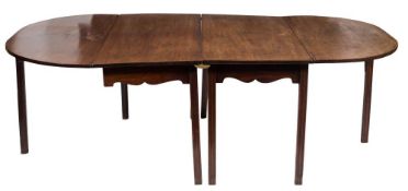 A George III mahogany D-end dining table:, in two sections,
