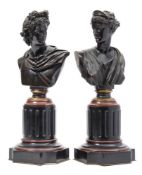 A pair of late 19th century Continental bronze busts of the Apollo Belvedere and Diana: mounted on