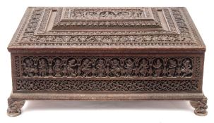 A 19th century Indian carved hardwood casket of large size: of rectangular outline,