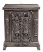 A cast iron stove:, with pierced foliate scroll and lattice panels,
