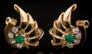 A pair of emerald and diamond fan-shaped ear clips: each with a circular emerald surrounded by four