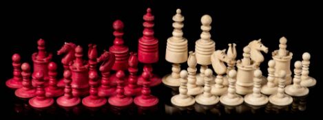 A 19th century Indian ivory Barleycorn-style pattern chess set: one side stained red,