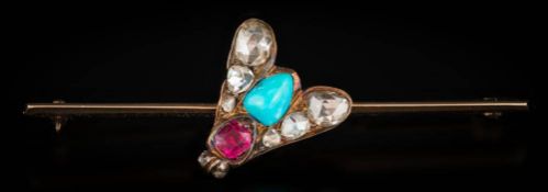 A rose diamond, turquoise and ruby mounted 'fly' bar brooch: approximately 51mm long, 4.
