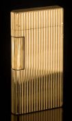 Caran d'Ache. A gold plated lighter: of ribbed design.