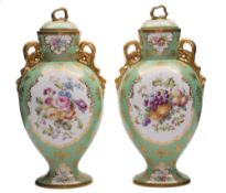 A pair of Copeland Spode vases and covers: of footed oviform with gilt ribbon handles and knops