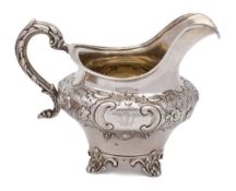 A Victorian silver cream jug, maker Robert Death, London, 1845: crested,