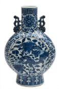 A Chinese blue and white moon flask: with pierced foliate handles,