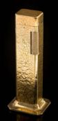 A Dunhill 'Tallboy' table lighter: of hammered finish, approximately 11cm overall height.
