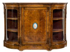 A Victorian burr walnut, inlaid and gilt metal and porcelain mounted credenza:,