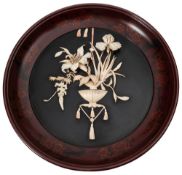 A Japanese lacquered and ivory panel: of circular outline,