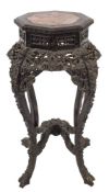 A Chinese carved and ebonised octagonal jardiniere stand:,