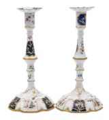 A pair of George III Bilston enamel candlesticks and sconces: each with knopped stem and domed foot,