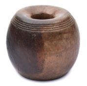 A lignum vitae horse tethering weight: of spherical form with two incised bands of concentric