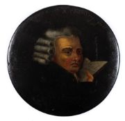 A 19th century papier mache snuff box: the circular lid decorated with a portrait of 'a country