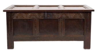 An early 18th Century oak rectangular coffer:, of moulded plain panel construction,