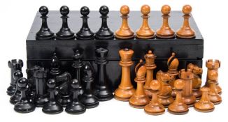 A Jacques-style Staunton pattern boxwood and ebony chess set : with weighted bases, the king 8cm.