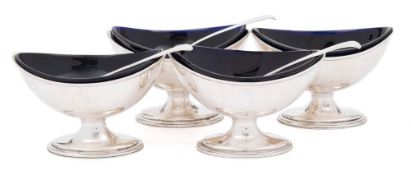 A set of four George III silver pedestal salts, maker Hester Bateman, London, 1786: crested,
