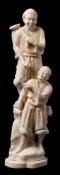 A Japanese carved ivory okimono: of fruit pickers, one smiling man standing above the other,